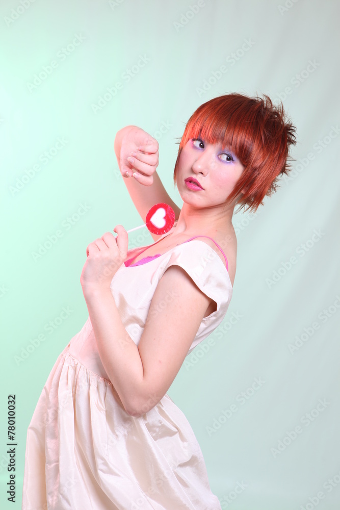 girl in satin dress with candy heart girl in satin dress with candy heart