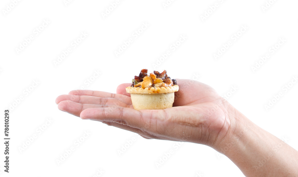 hand holding fruit tart hand holding fruit tart