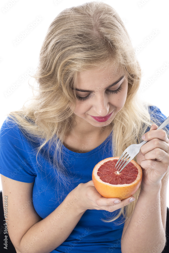 Model Released. Attractive Young Woman Holding a Pink Grapefruit Model Released. Attractive Young Woman Holding a Pink Grapefruit