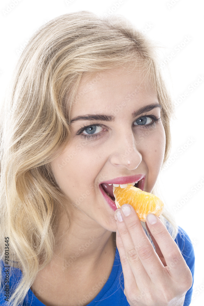 Model Released. Young Woman Eating an Orange Segment Model Released. Young Woman Eating an Orange Segment