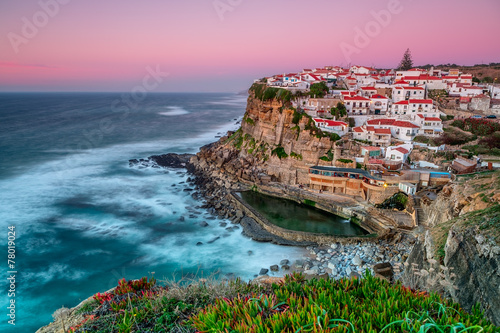 Sunset in the town Azenhas do Mar. With natural pool. photo