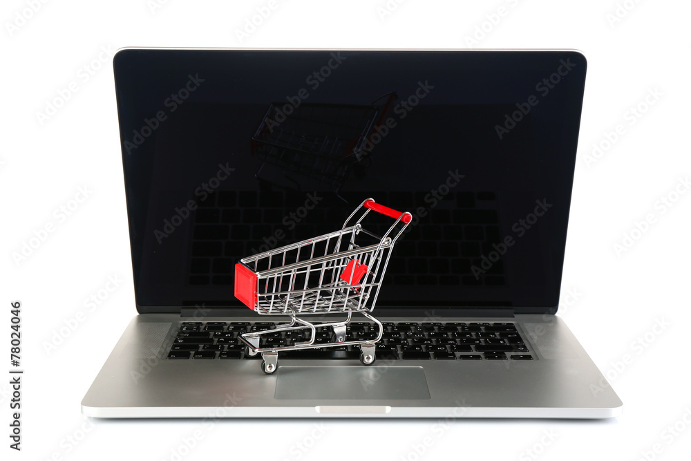 Laptop with small shopping cart isolated on white background Laptop with small shopping cart isolated on white background