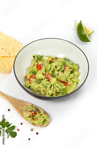 Guacamole on white background. Selective focus.
