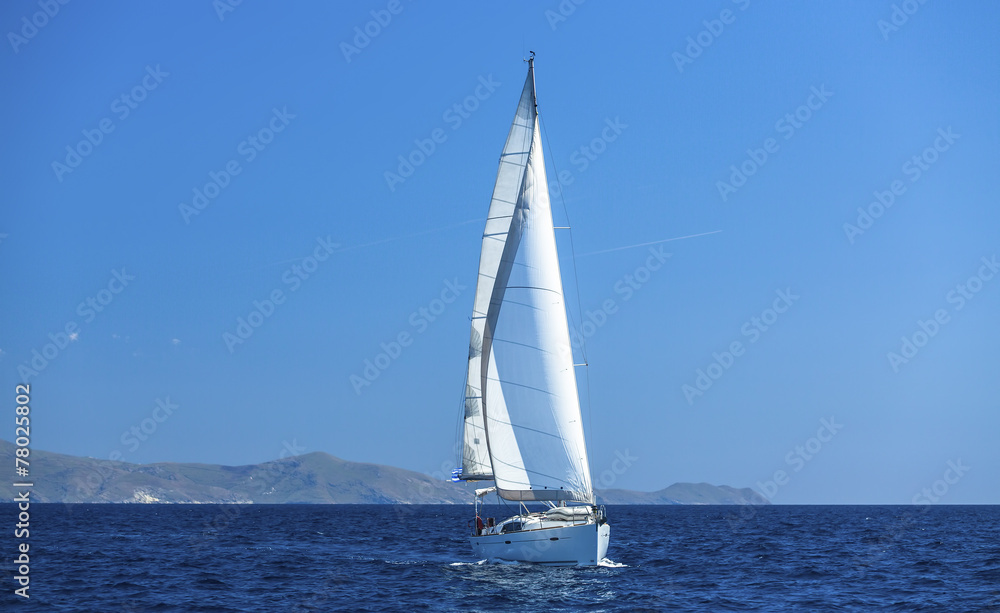 Sailing ship yachts with white sails. Luxery sailing yacht.