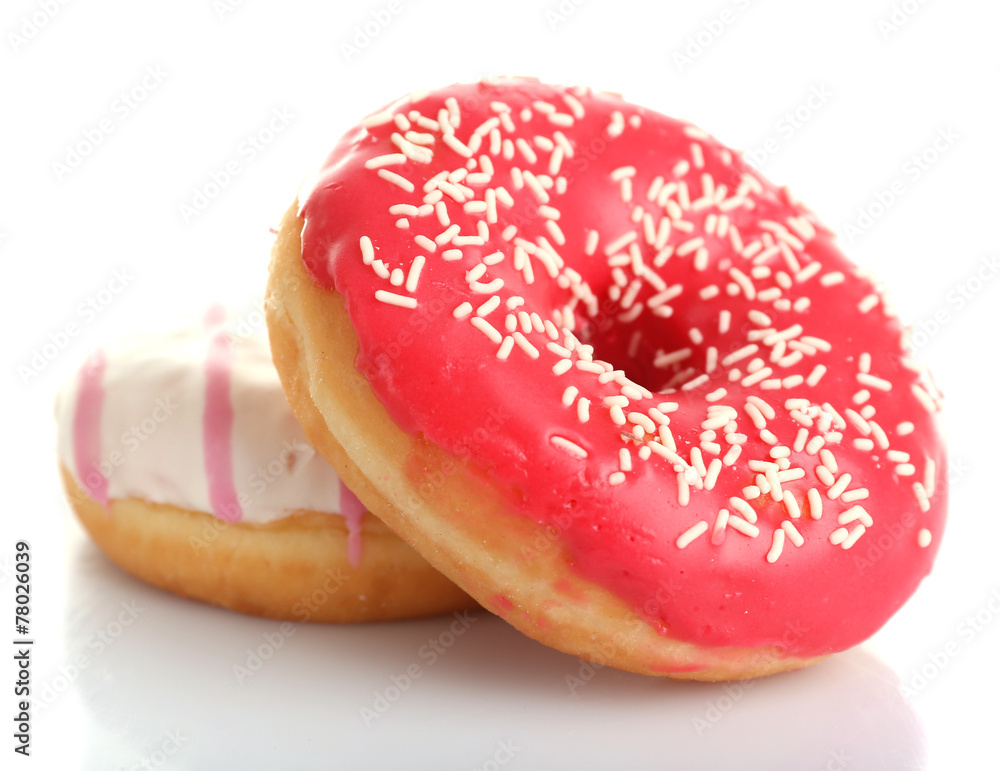 Delicious donuts with icing isolated on white Delicious donuts with icing isolated on white