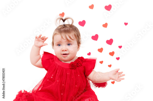 Adorable girl in red dress with a heart in the background