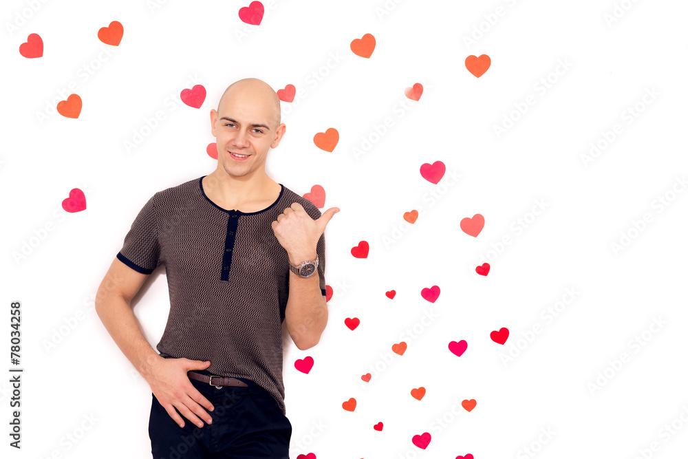 guy near the wall with a heart in the background.Valentine's Day