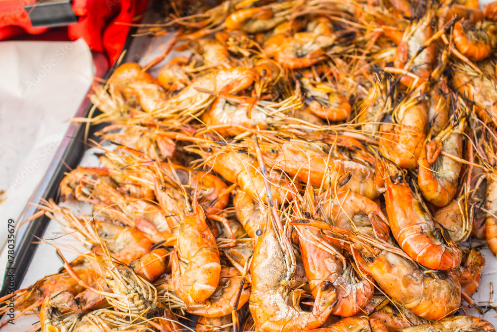 Grilled shrimp on a tray.