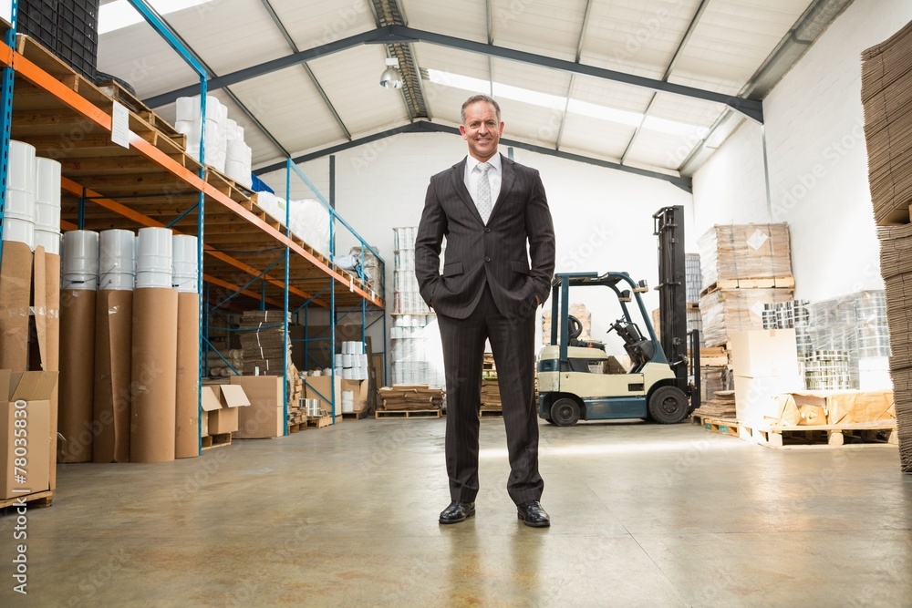 Fototapeta premium Warehouse manager standing with hands in the pocket