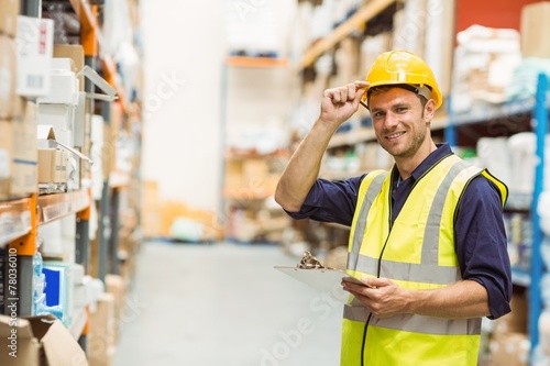 Portrait of warehouse worker with clipboard