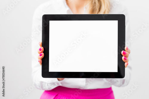 Woman holding ipad with empty white screen