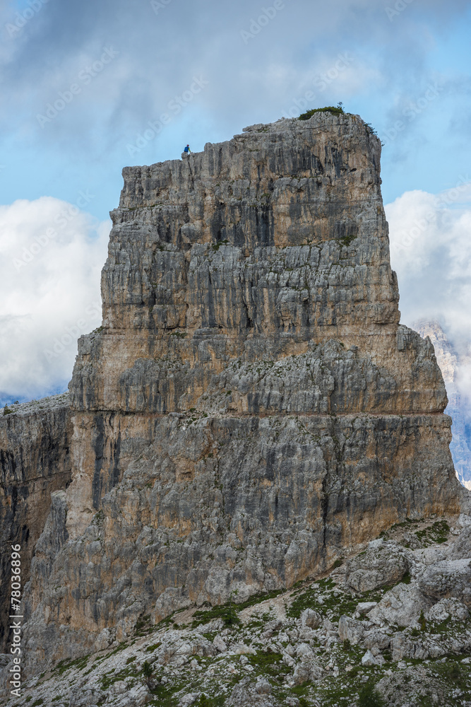 Climber on the top of one of the Cinque Torri mountain,Dolomites