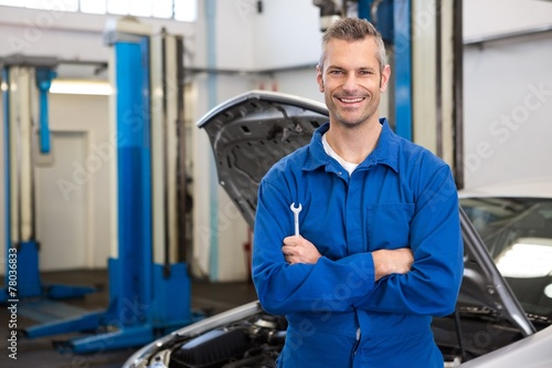 Mechanic smiling at the camera