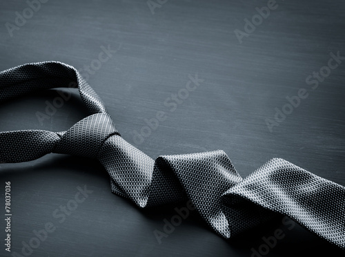 Murais de parede Grey tie on dark background