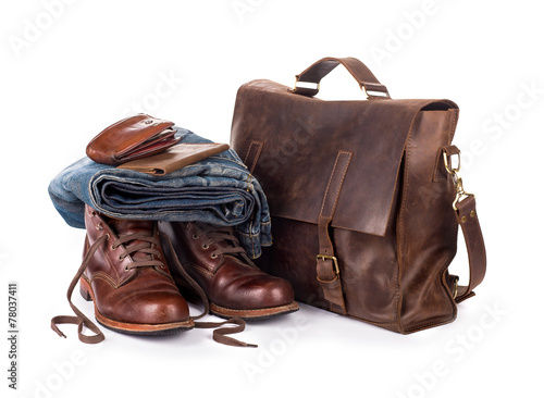 set consisting of jeans belt and bag on a white background
