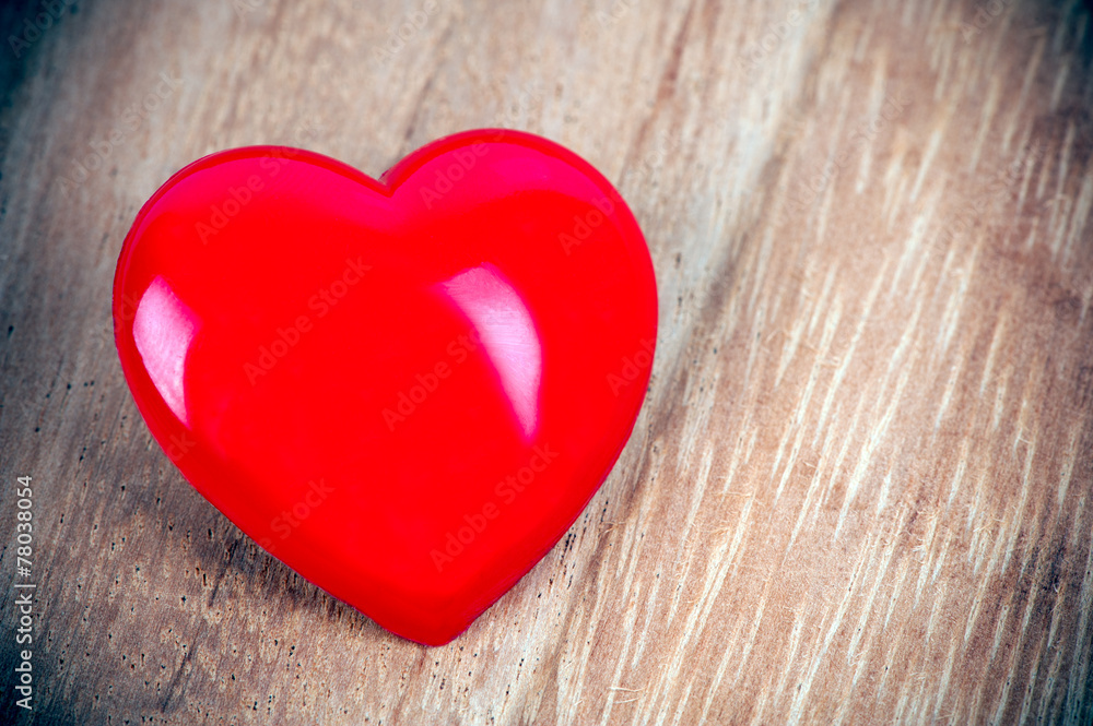 Fototapeta premium Red heart on a wooden background