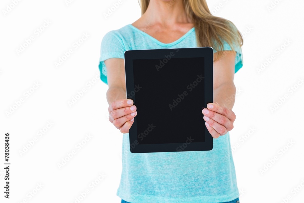 Mid section of woman showing a tablet pc