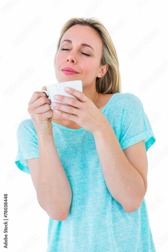 Peaceful blonde with hot beverage relaxing Peaceful blonde with hot beverage relaxing