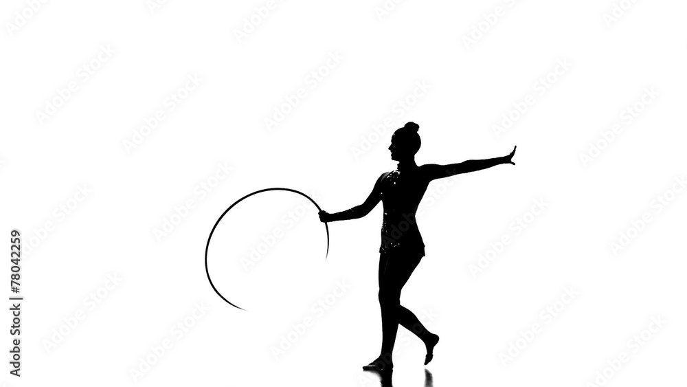 Silhouettes Gymnastic stunt with hula hoop from the beautiful Silhouettes Gymnastic stunt with hula hoop from the beautiful