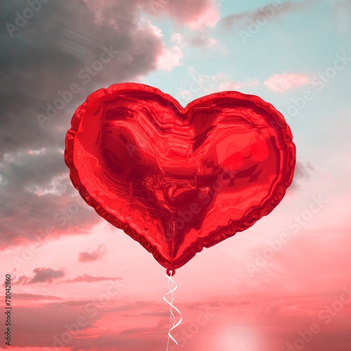 Composite image of red heart balloon