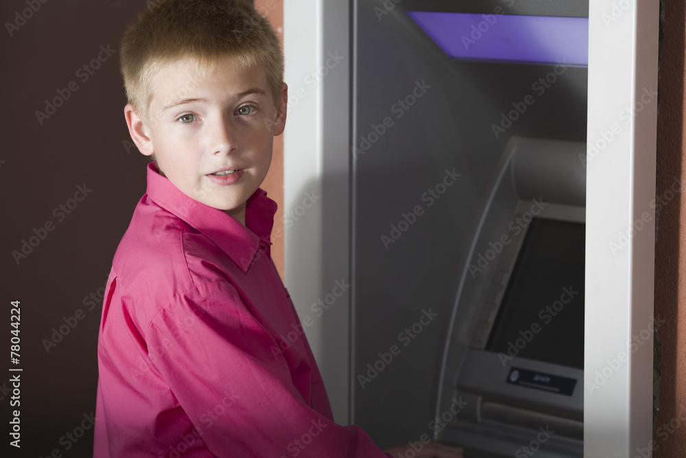 The boy's portrait at the bank ATM terminal The boy's portrait at the bank ATM terminal