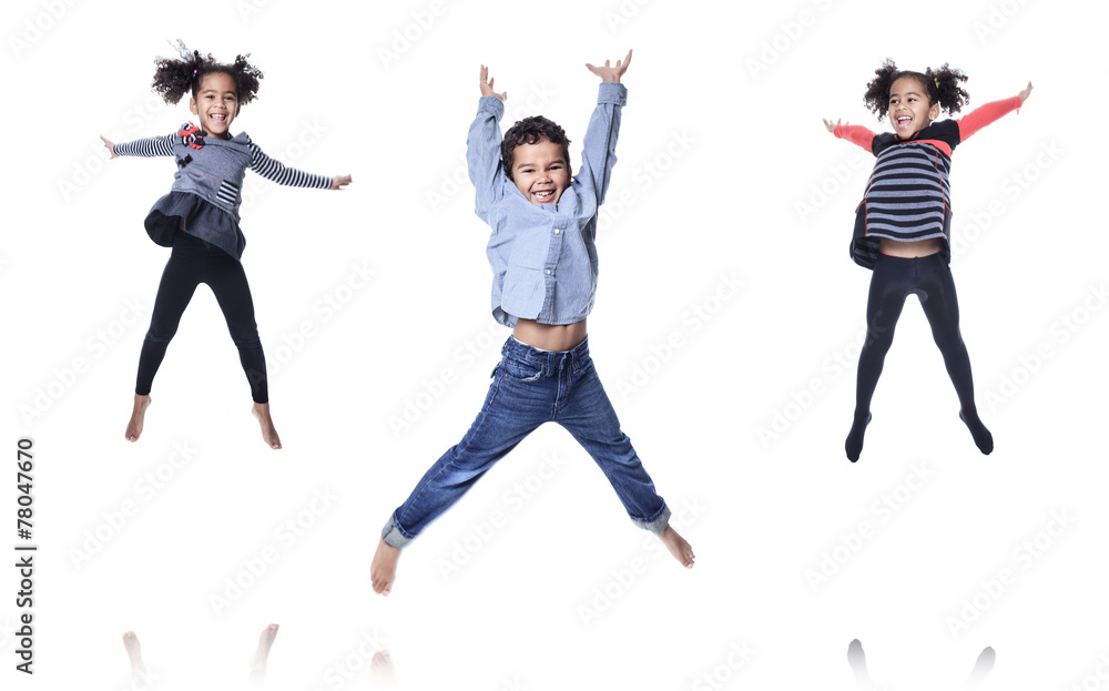 A cute african american little boy jump isolated on white backgr A cute african american little boy jump isolated on white backgr