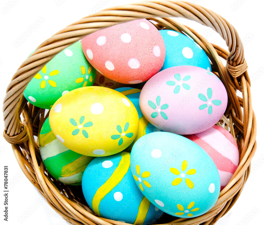Colorful handmade easter eggs in the basket isolated Colorful handmade easter eggs in the basket isolated