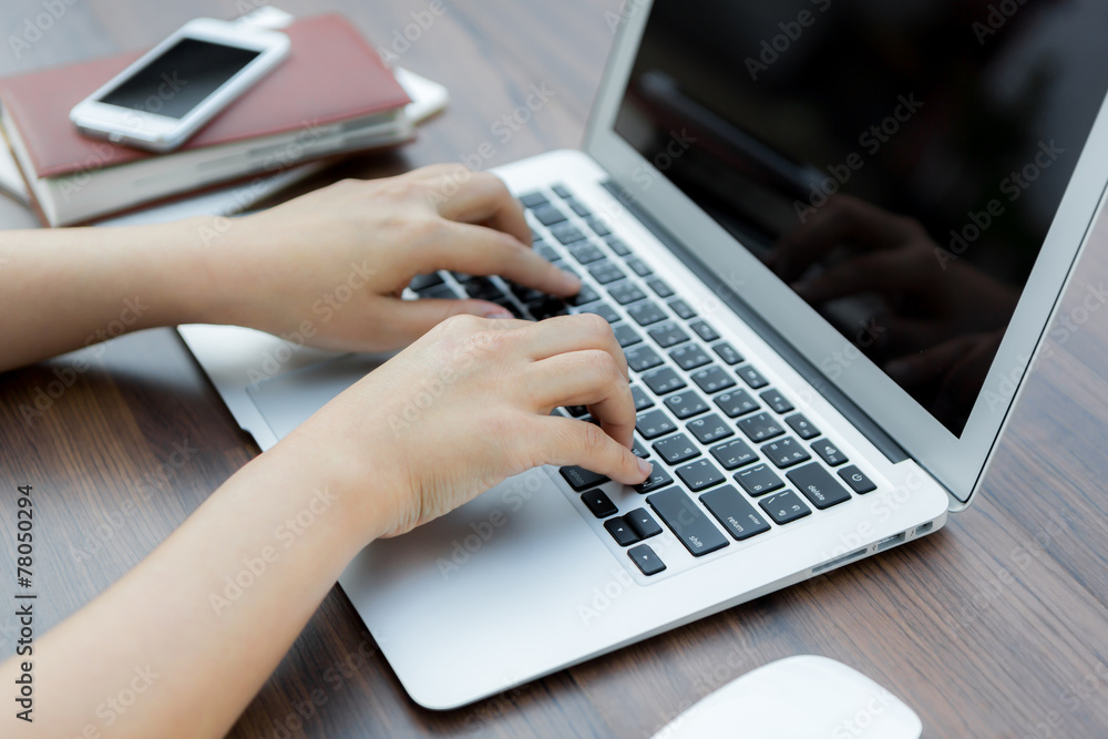 Closeup of business woman hand typing on laptop keyboard Closeup of business woman hand typing on laptop keyboard