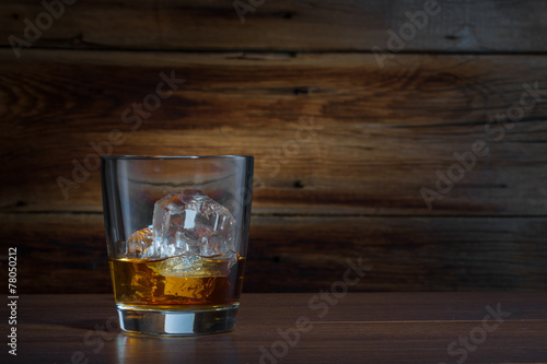 whiskey on a wooden background