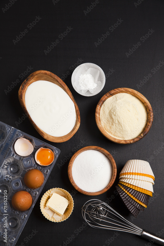 baking ingredients on dark. yogurt, semolina, eggs & butter. kit baking ingredients on dark. yogurt, semolina, eggs & butter. kit