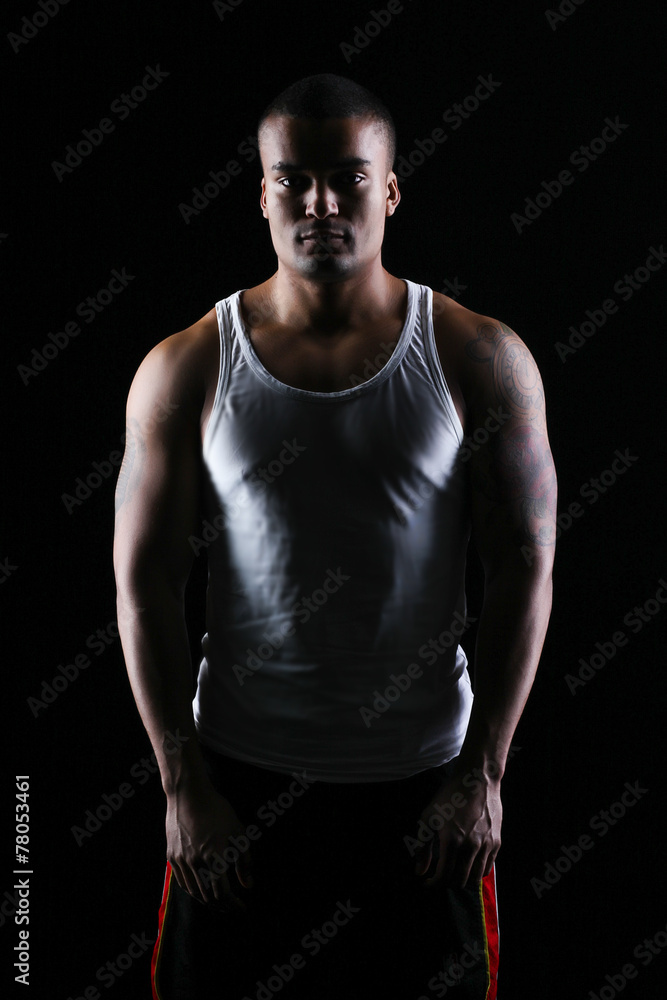 Strong man with perfect body posing in studio Strong man with perfect body posing in studio