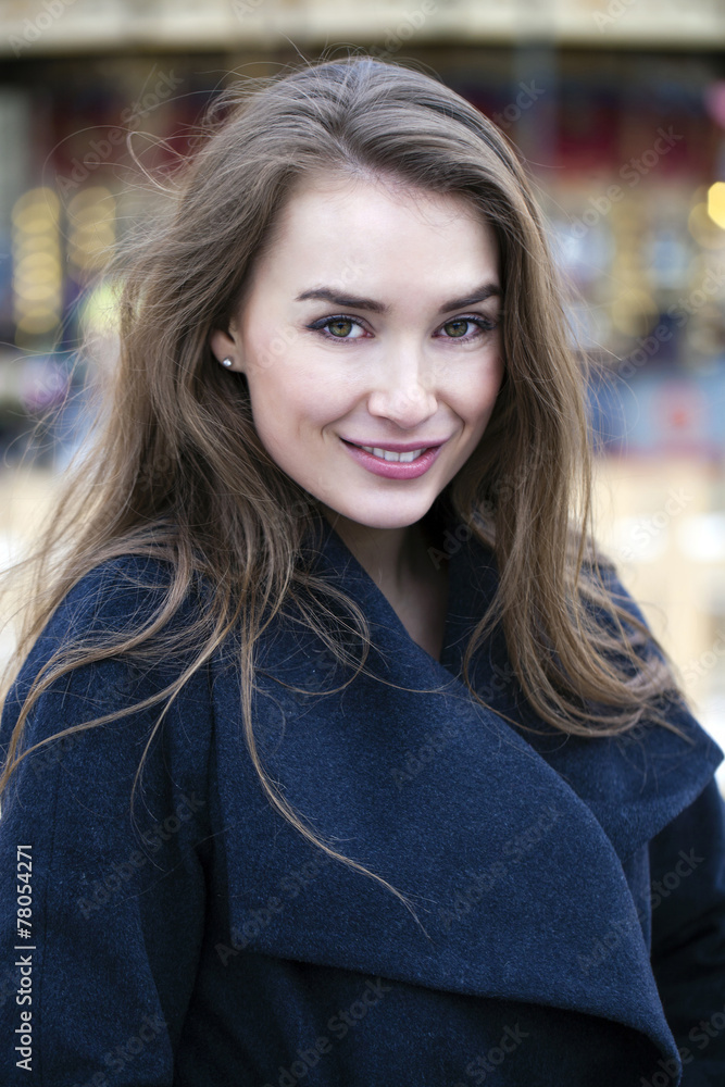 Obraz premium Young beautiful woman in stylish dark gray wool coat