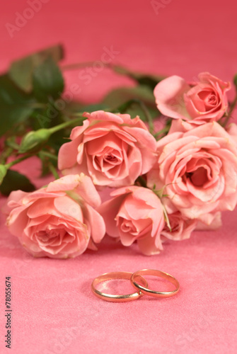 Golden ring and roses for wedding