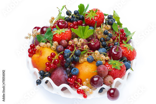 dish with fruit and seasonal berries  top view  isolated