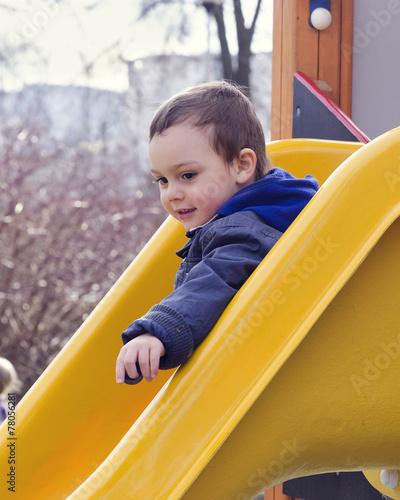Child on playground slide