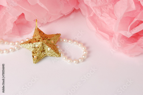 Decorative star  pearl beads and pink pom pom.