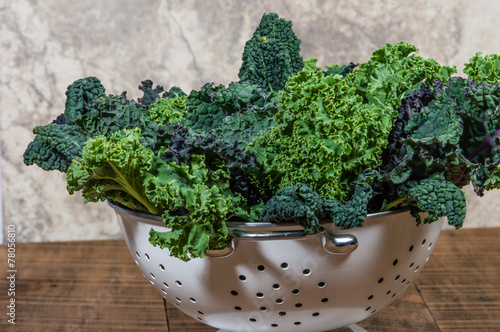 Red and green kale in colander