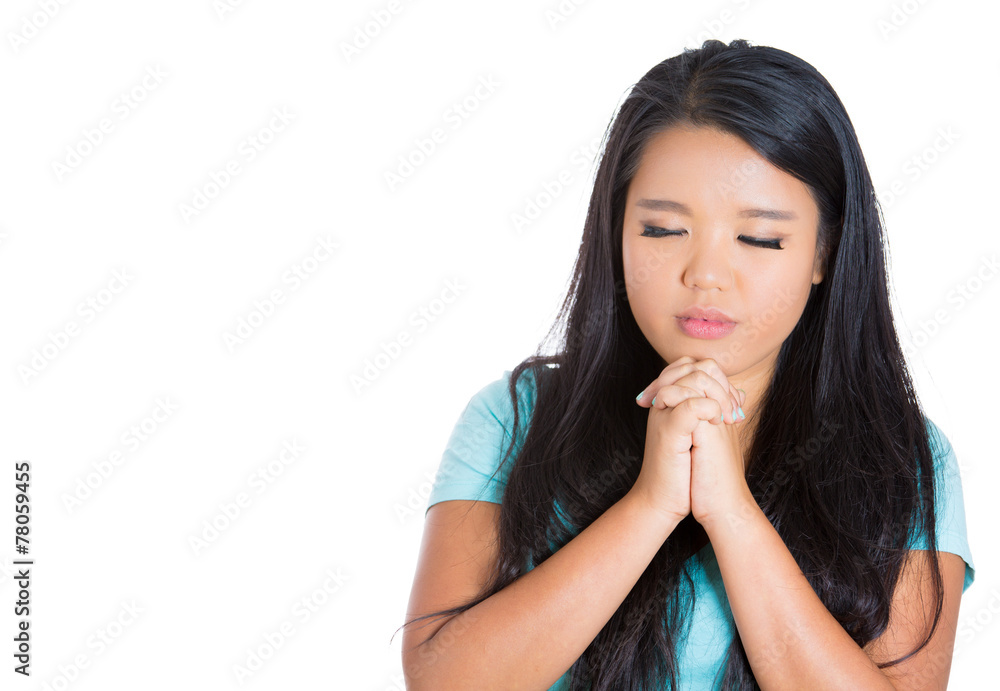 Portrait teenager girl praying arms clasped eyes closed Portrait teenager girl praying arms clasped eyes closed