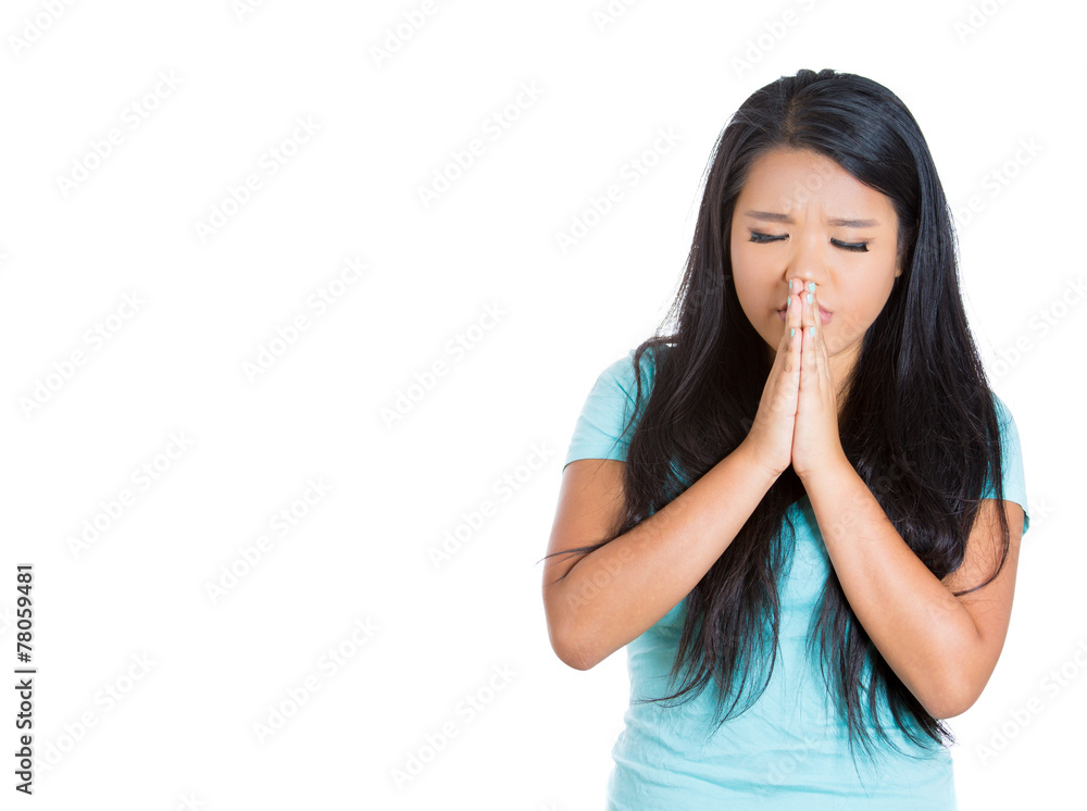 Portrait teenager girl praying arms clasped eyes closed Portrait teenager girl praying arms clasped eyes closed