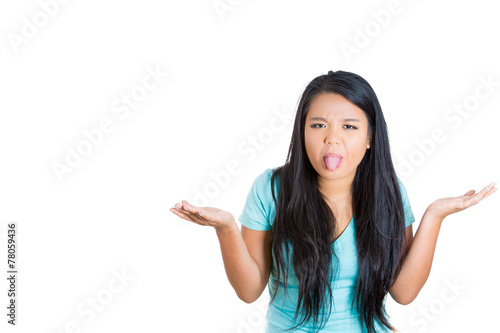 Εκτύπωση καμβά Displeased young woman sticking her tongue shrugs shoulders
