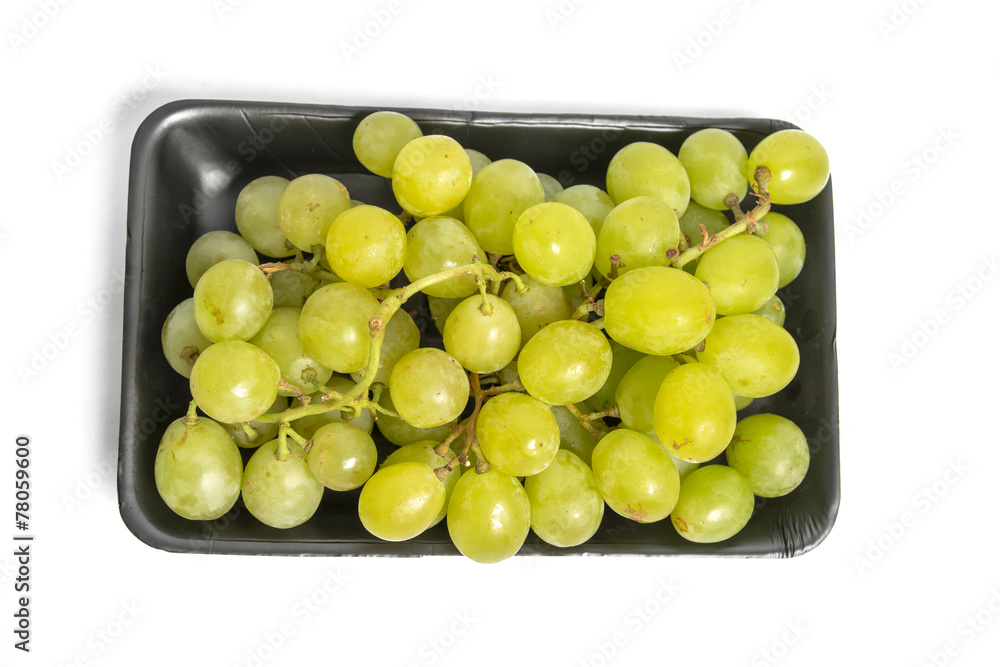 green grape in black styrofoam with isolated white background green grape in black styrofoam with isolated white background