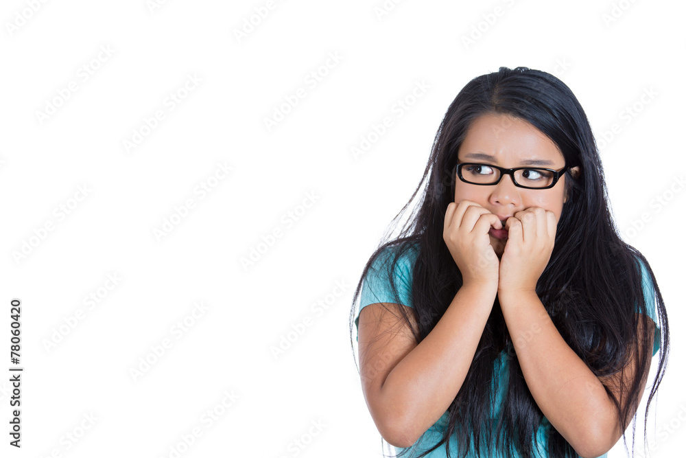 Scared anxious young woman biting fingernails white background 