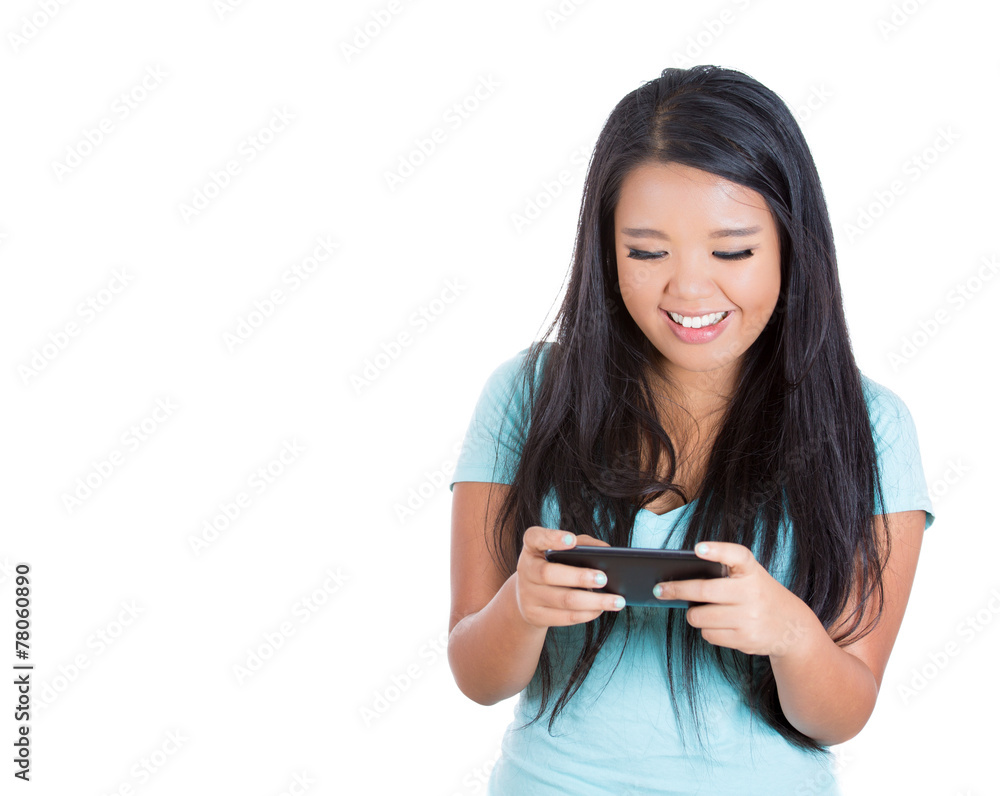 Happy teenager girl texting on her smart phone Happy teenager girl texting on her smart phone