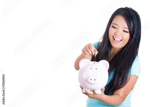 Young woman with piggy bank isolated on white background 