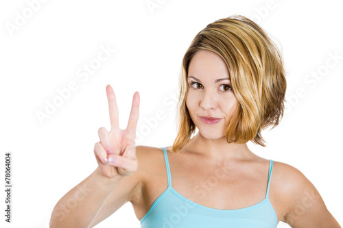 Portrait lovely teenage girl showing victory or peace sign