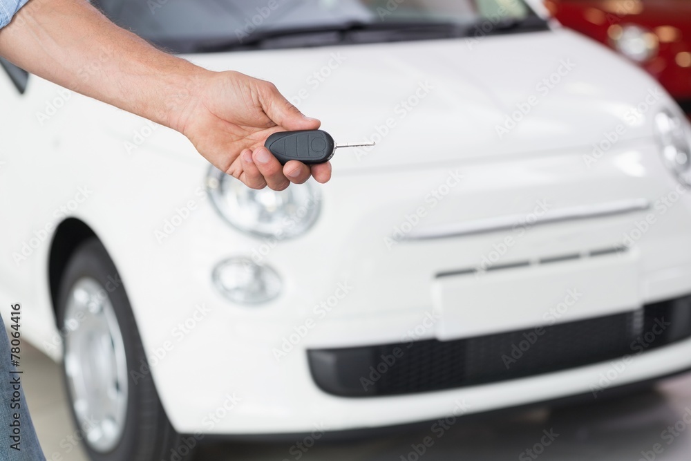 Close up of customer showing his new key Close up of customer showing his new key