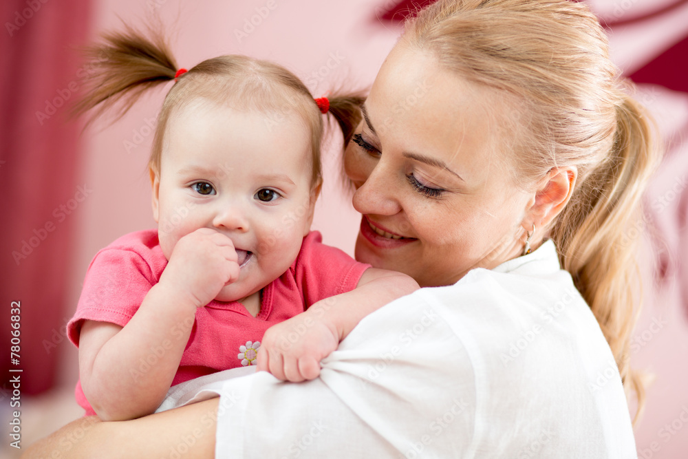 Portrait of a joyful mother and her baby daughter Portrait of a joyful mother and her baby daughter