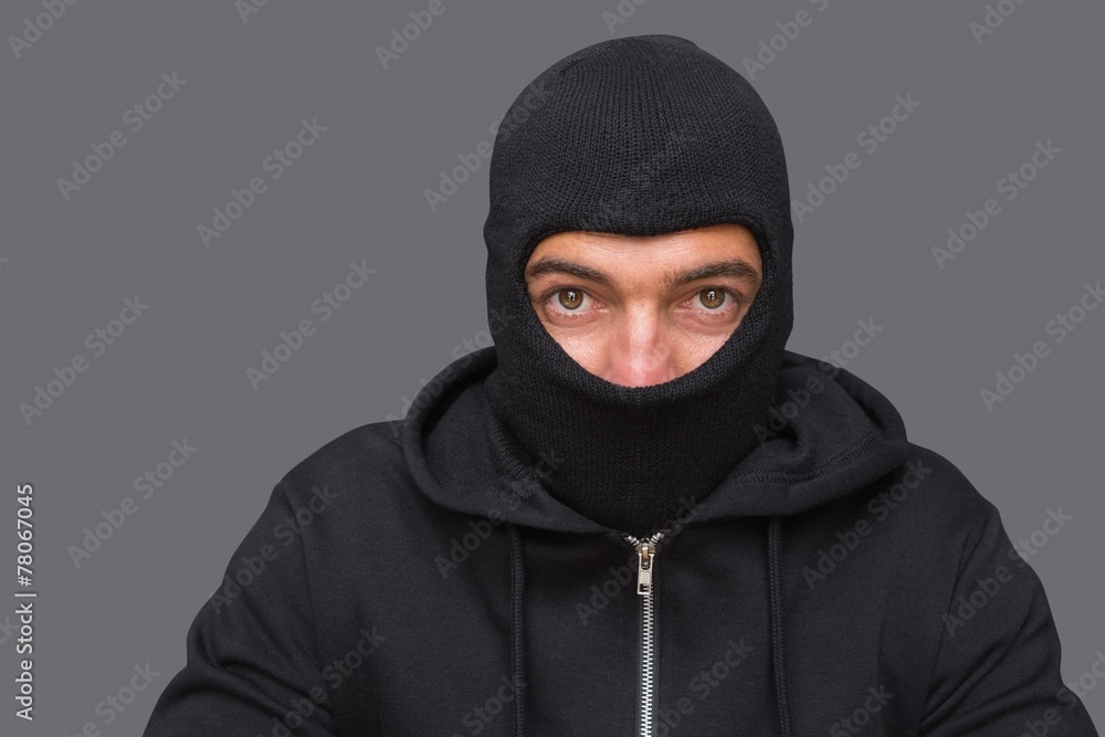 Man in balaclava looking at camera Man in balaclava looking at camera