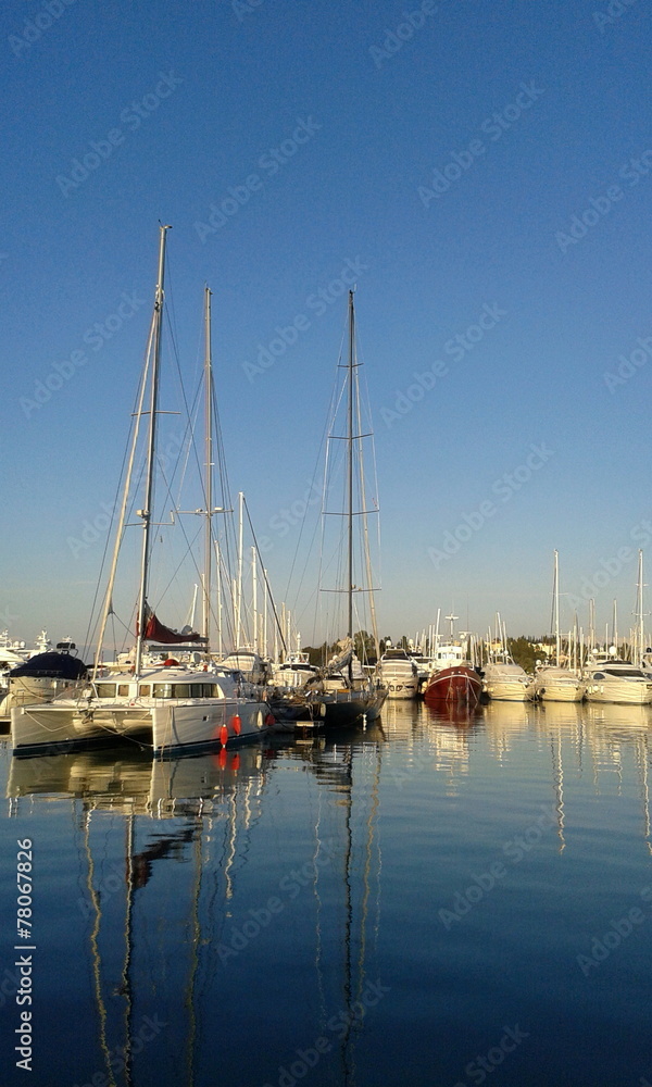 	 Yachts and sail boats reflected in a Marina	