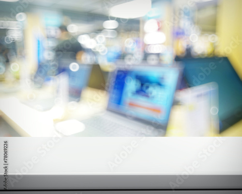 Empty laminate shelf and blurred background for business product